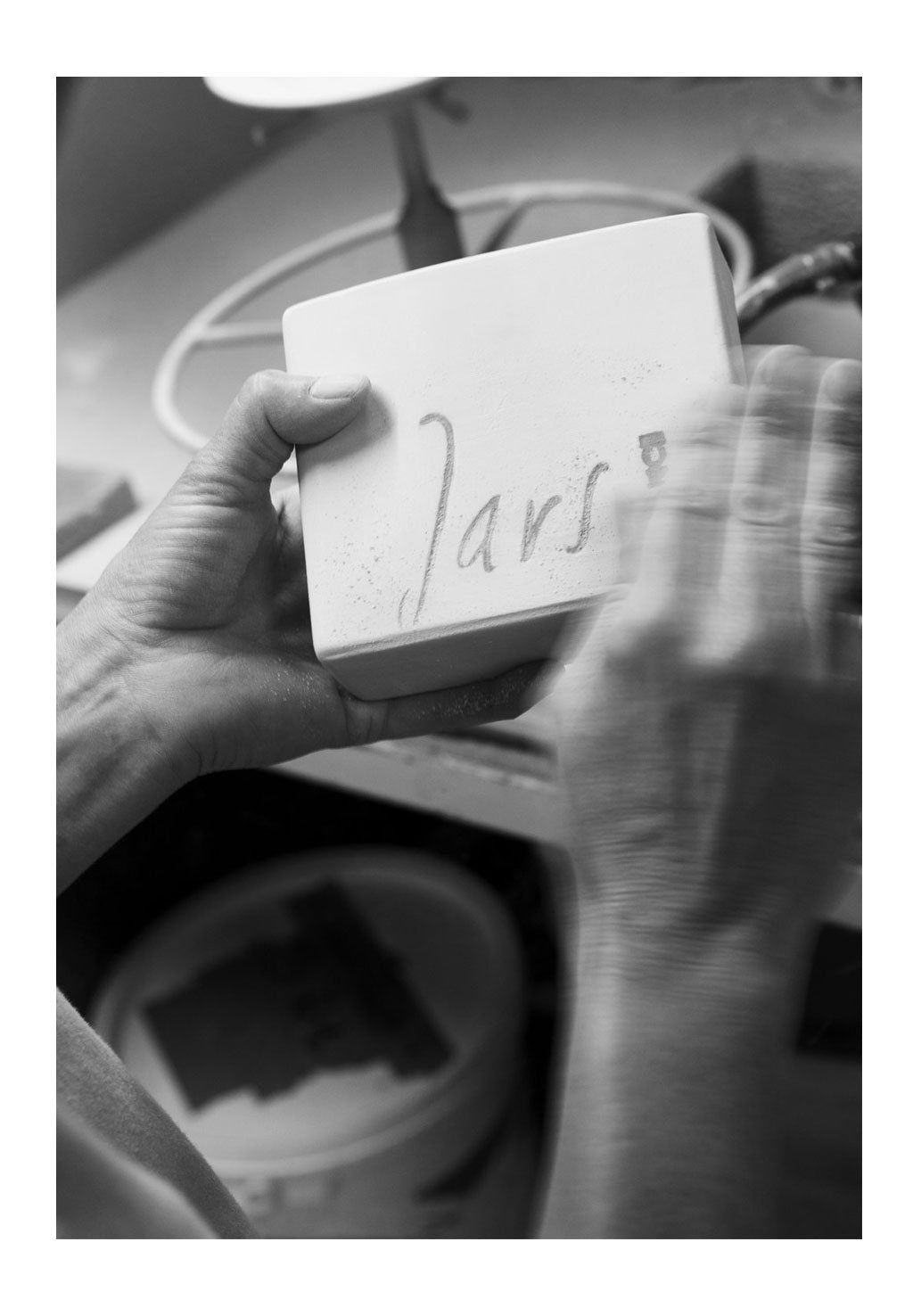 A close-up of hands holding a block